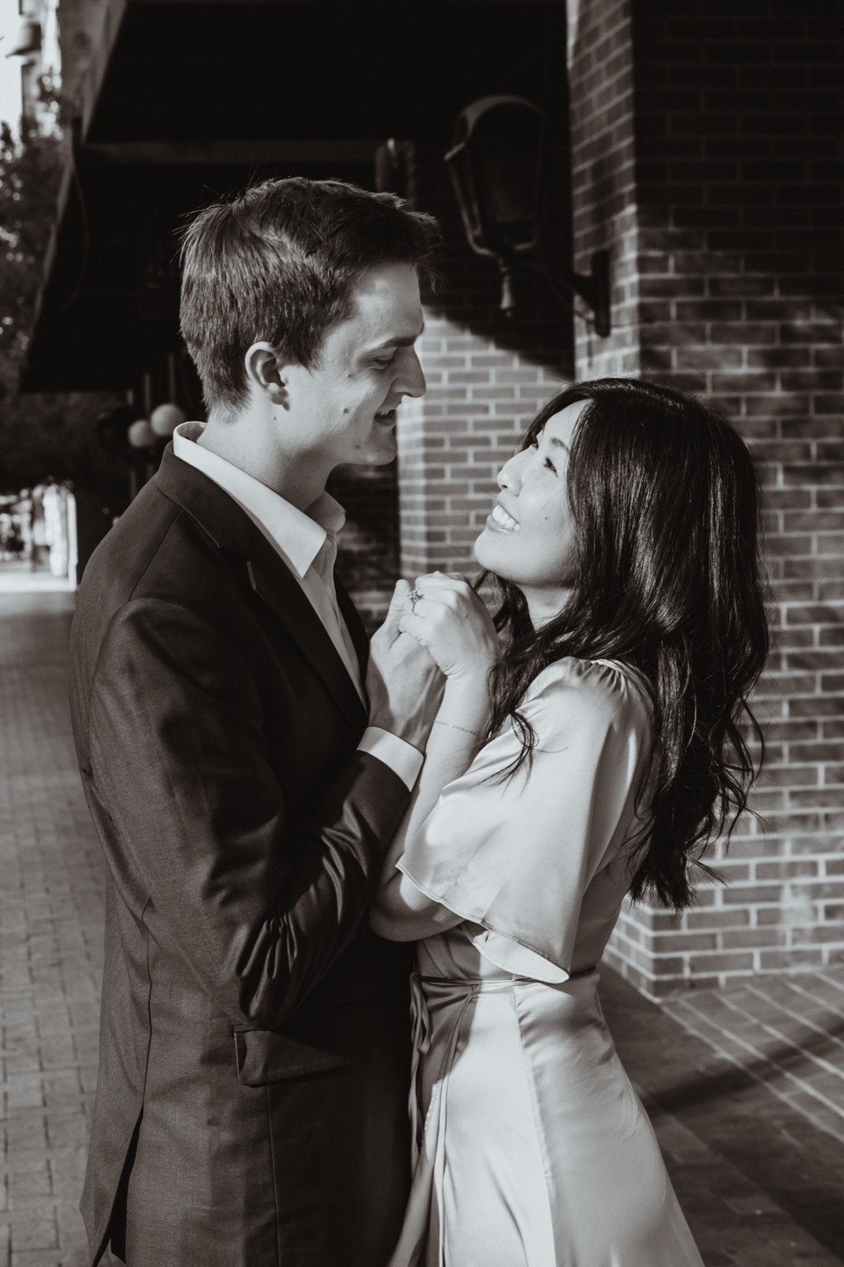 Laughing together on a brick street